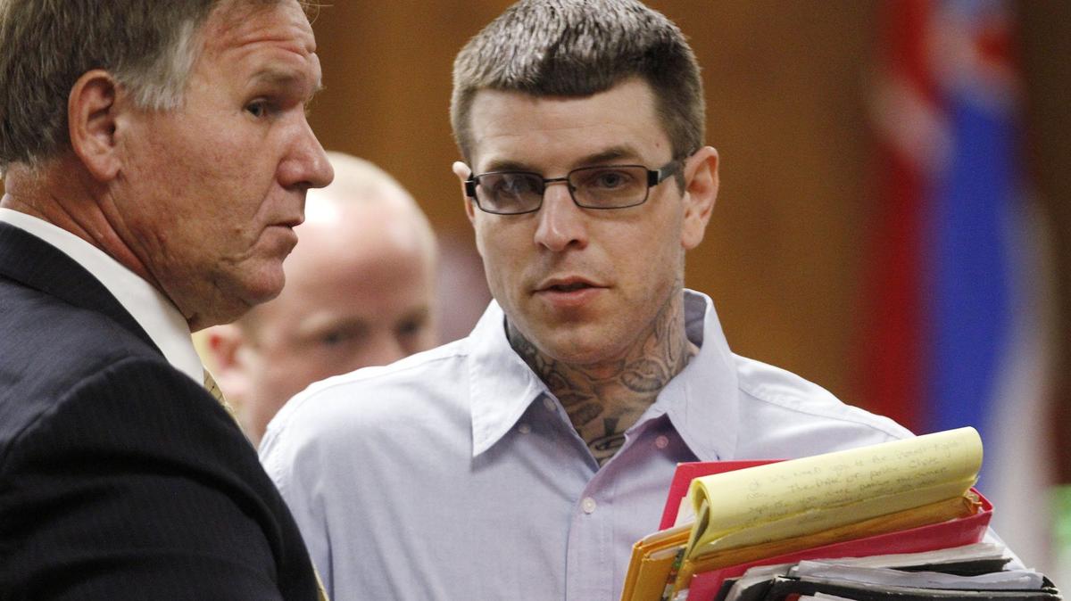 Joshua Peterman, right, talks to his attorney, Phil Wittmann, before the second day of Peterman's murder trial starts Wednesday in Harrison County Circuit Court. Peterman is accused of murdering Tena Broadus of Gulfport in September 2015.