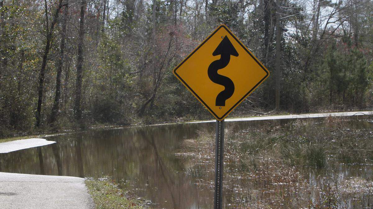 TIM ISBELL/SUN HERALD/FILE 
 Flood waters cover Woolmarket Lake Road in 2012.