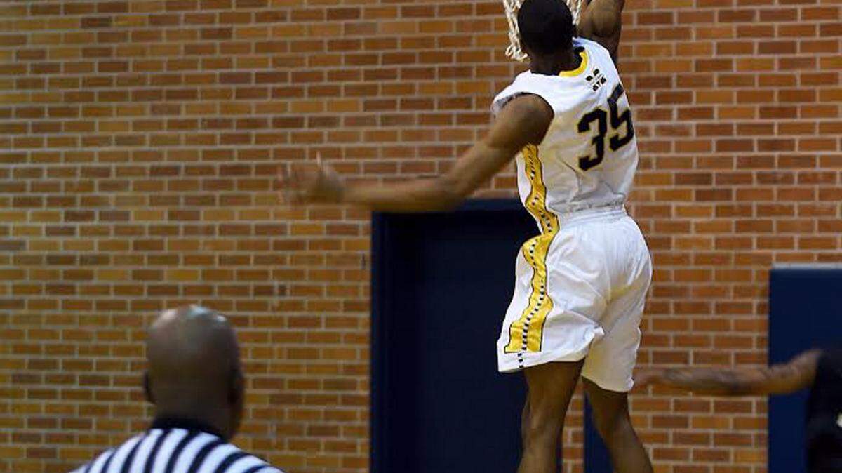 RICH KOPP/MGCCC 
 #35 Anfernee Hampton slams for Gulf Coast, who beat East Central on Thursday.