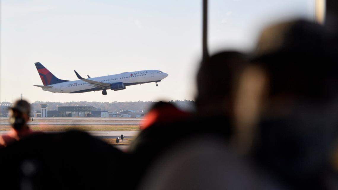 A Georgia doctor is charged after he’s accused of repeatedly groping a woman on Delta flight to Maine, federal investigators said. (AP Photo/Mike Stewart)