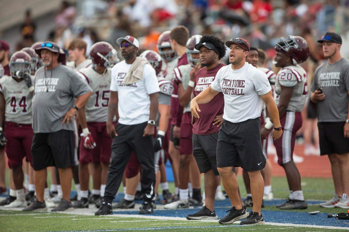 The Picayune coaching staff yells to their players during a spring game against Ocean Springs at Greyhound Stadium in Ocean Springs on Friday, May 13, 2022.