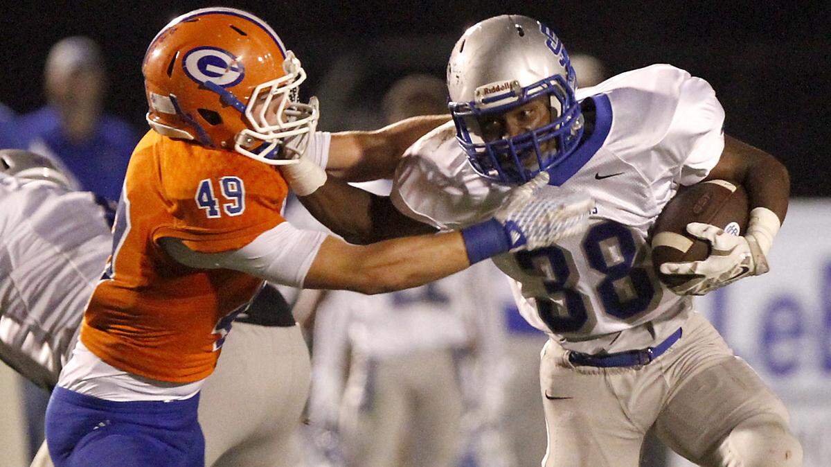 TIM ISBELL/SUN HERALD 
 Trexton Coleman (38) and the Ocean Springs Greyhounds will jostle with D'Iberville, St. Martin and Harrison Central for the final three playoff spots in Region 4-6A.