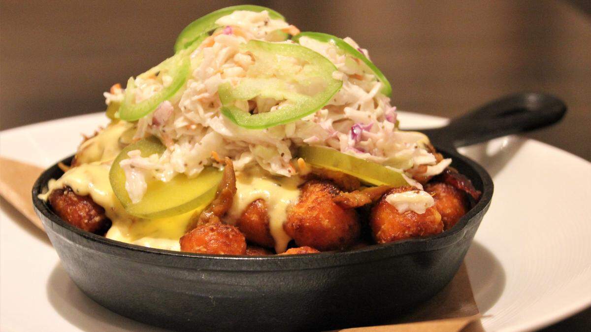 Delightful barbecue pulled pork sweet potato tots.