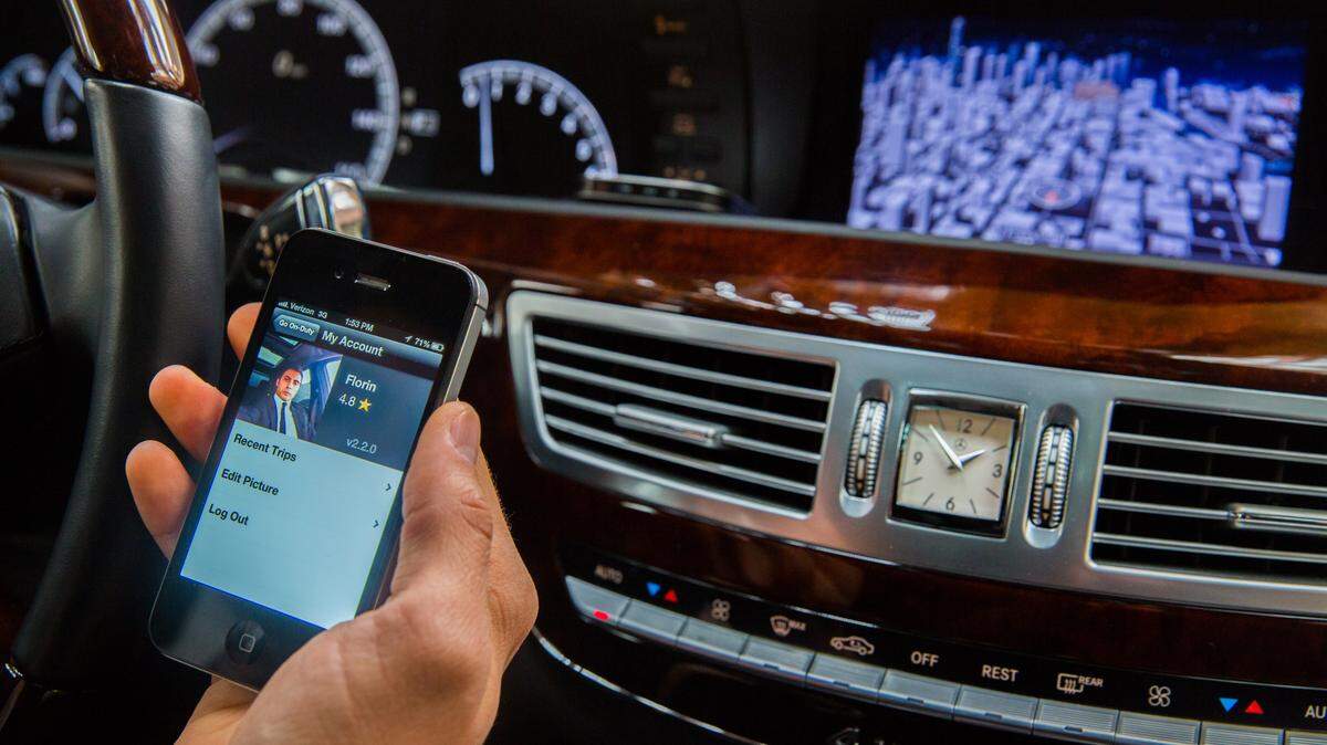 MCTLimousine driver Florian Bucea checks his Uber service in Chicago in 2013. Ocean Springs leaders are interested at looking into the service for their city.