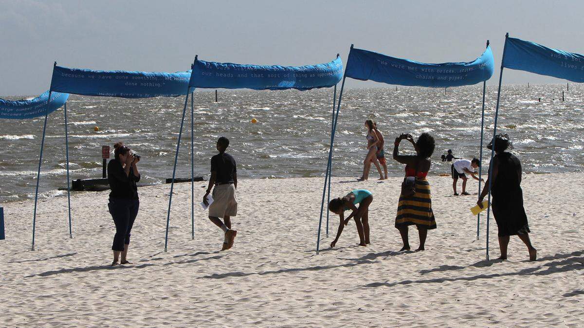JOHN FITZHUGH/SUN HERALD/FILE 
 Participants walk though a tribute in 2015 to commemorate the Biloxi wade-in near the Biloxi Lighthouse. This year, a wade-in remembrance May 12 will be part of Biloxi's Preservation in May series.