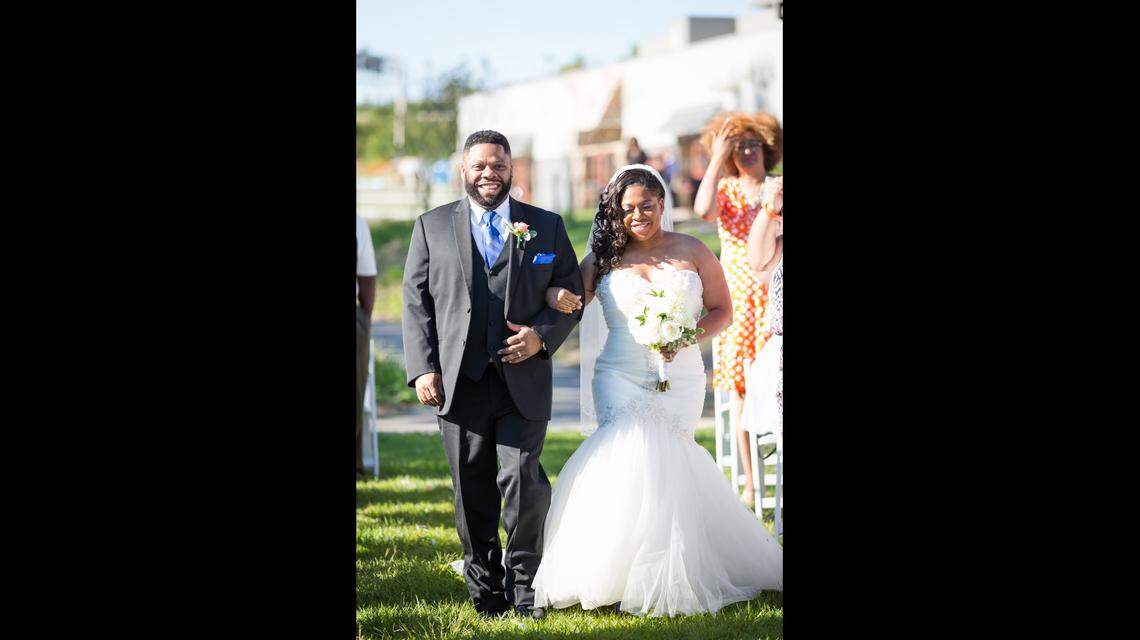 Leonard Parker and his wife, Catina McGahee Parker, on their wedding day.