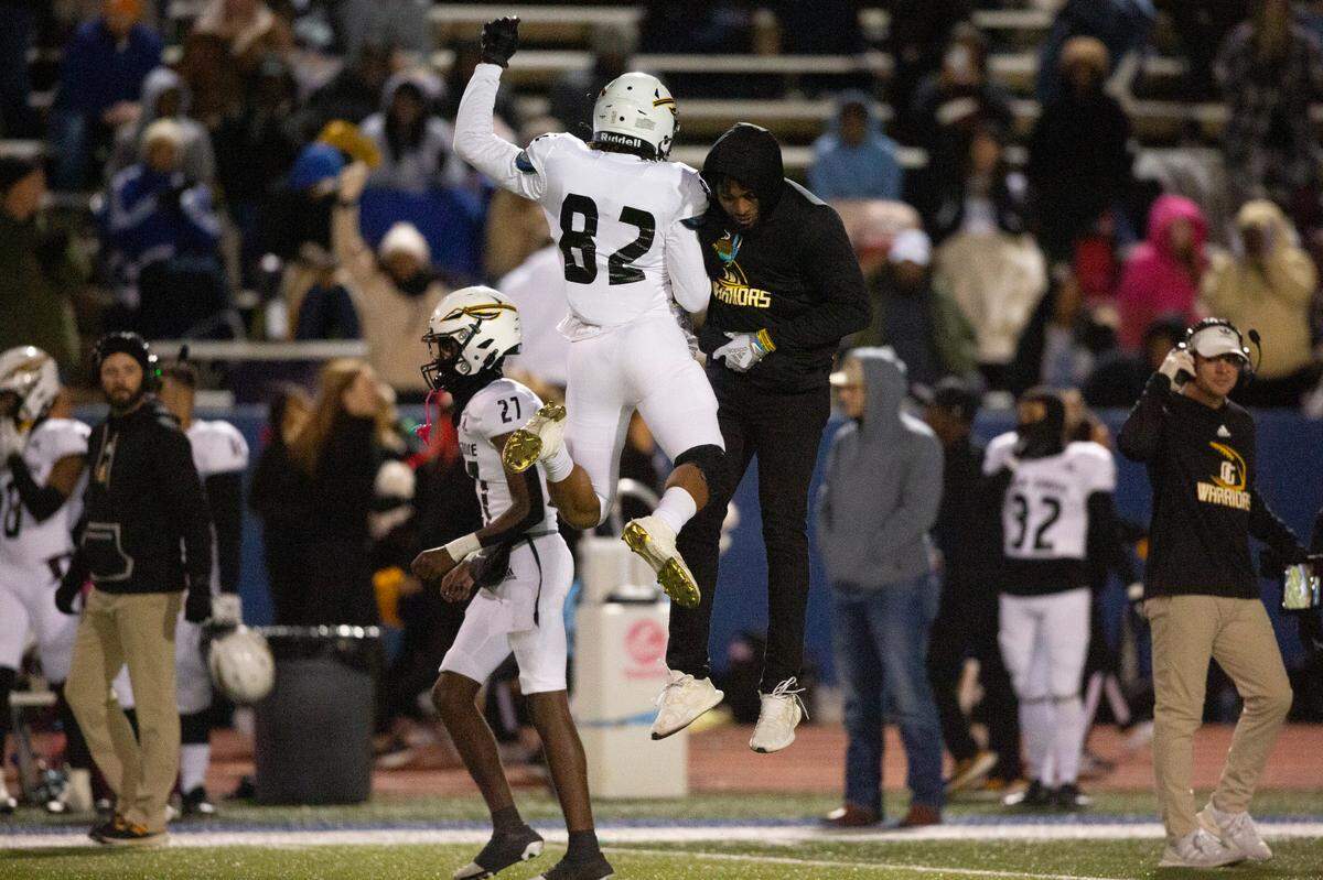 Oak Grove players celebrate after a touchdown against Ocean Springs during a 6A playoff game at Greyhound Stadium in Ocean Springs on Friday, Nov. 18, 2022.