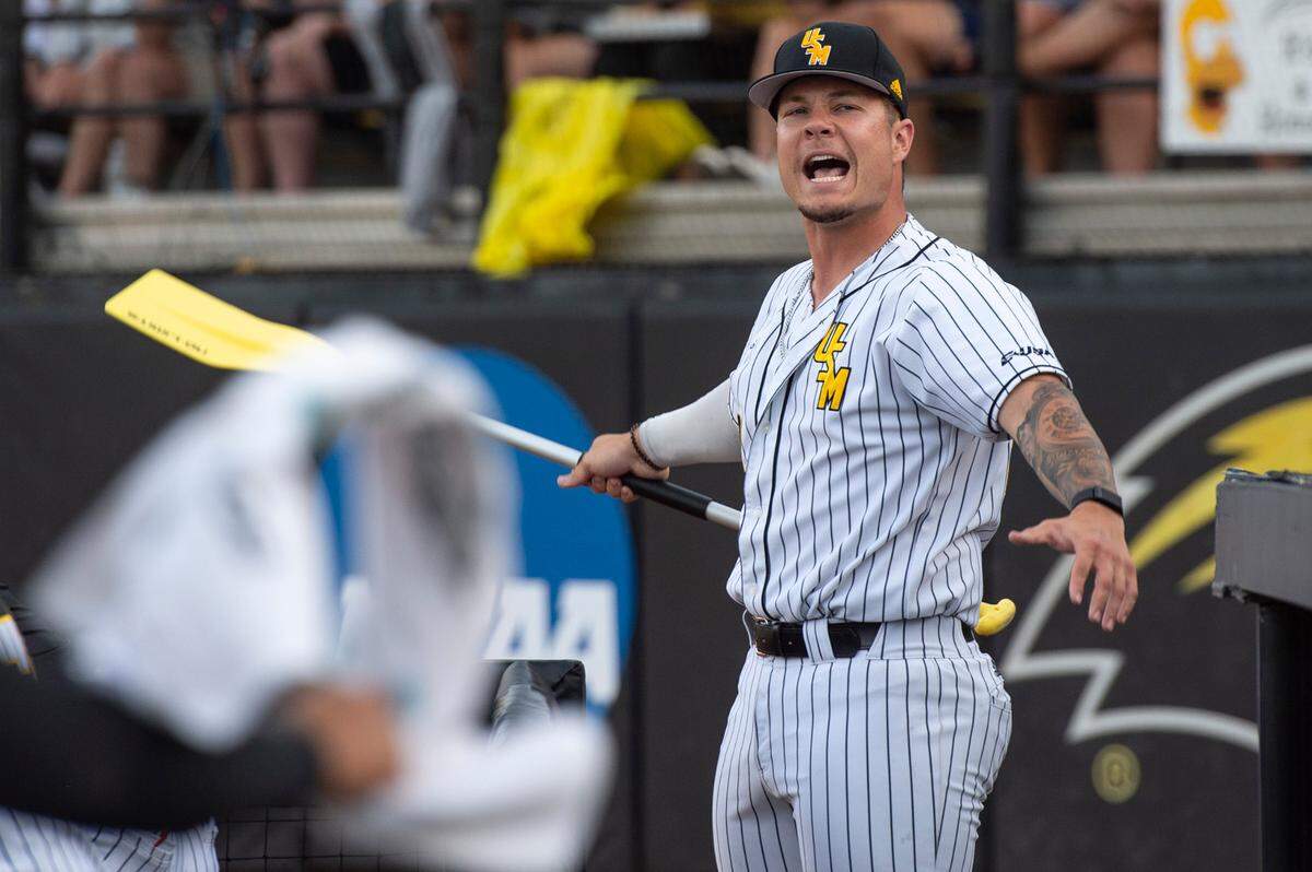 Southern Miss’s Charlie Fischer carries the rally paddle during a game against LSU in the NCAA Regionals at Pete Taylor Park in Hattiesburg on Monday, June 6, 2022.