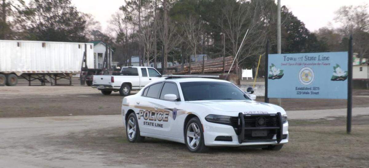 A State Line police cruiser sits parked outside of the State Line police department.
