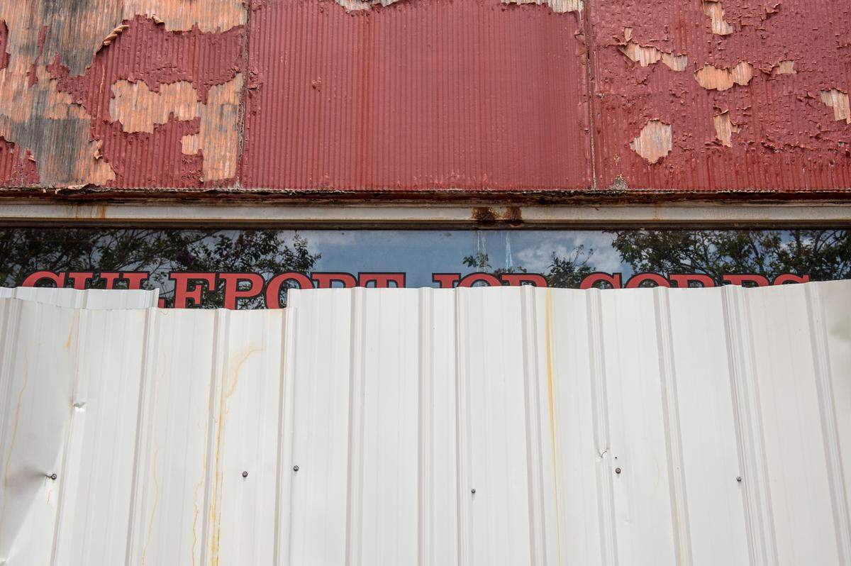 A sign reading “Gulfport Jobs Corps” is covered up by sheet metal on the old 33rd Ave. School on Tuesday, Aug. 10, 2021. The old school building served as a job corps before Hurricane Katrina but has been empty since.