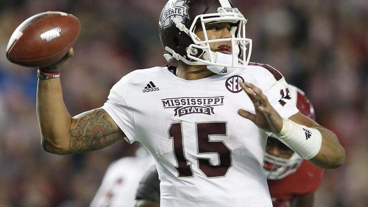 Mississippi State quarterback Dak Prescott throws the ball against Alabama during the second half of an NCAA college football game Saturday, Nov. 15, 2014, in Tuscaloosa, Ala. Alabama won 25-20. (AP Photo/Brynn Anderson)