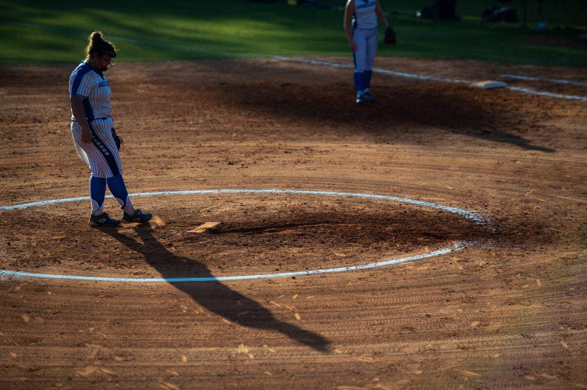 Vancleave pitcher Bryn Daughtery brushes dirt off the mound before pitching to George County during a game at Vancleave High School in Vancleave on Friday, May 6, 2022.