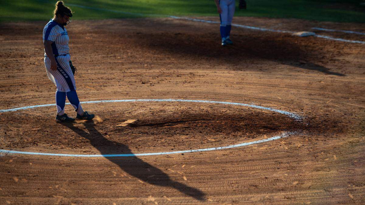 Vancleave pitcher Bryn Daughtery brushes dirt off the mound before pitching to George County during a game at Vancleave High School in Vancleave on Friday, May 6, 2022.