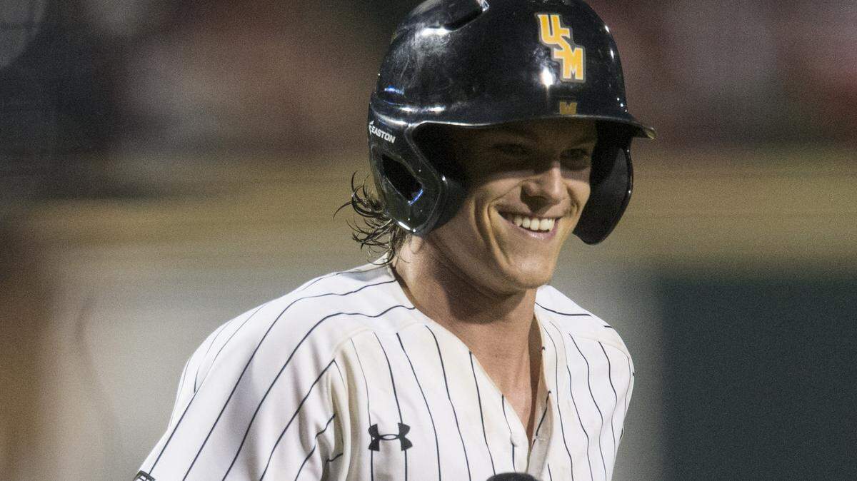 Southern Mississippi's Cole Donaldson smiles after hitting a three-run homer in the sixth inning against Dallas Baptist during an NCAA college baseball tournament regional game Friday, June 1, 2018, in Fayetteville, Ark.