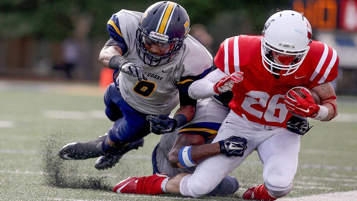 AMANDA McCOY/SUN HERALD 
 Gulf Coast's Cam Myers and Jay Jay Smith combine for a tackle during last week's homecoming game against Itawamba. The two teams will clash at 2 p.m. Saturday to open the MACJC playoffs.
