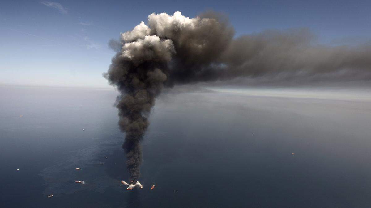 GERALD HERBERT/ASSOCIATED PRESS 
 A large plume of smoke rises from fires on BP's Deepwater Horizon offshore oil rig off the Coast of Mississippi in 2010.
