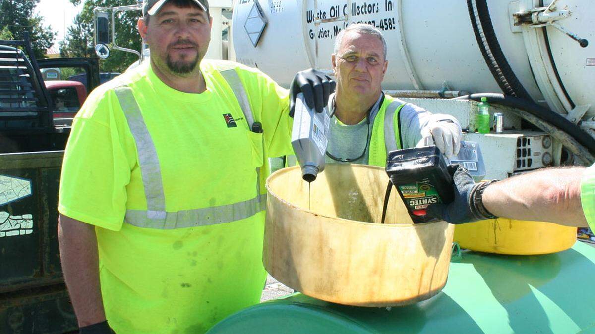 JACKSON COUNTY 
 
 County workers and volunteers collect waste oil at a previous household hazardous waste day in Jackson County.