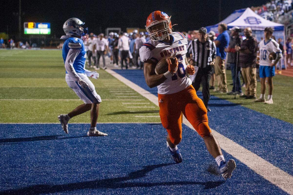 Gulfport’s Cooper Crosby scores a touchdown during a game at Greyhound Stadium in Ocean Springs on Friday, Oct. 28, 2022.