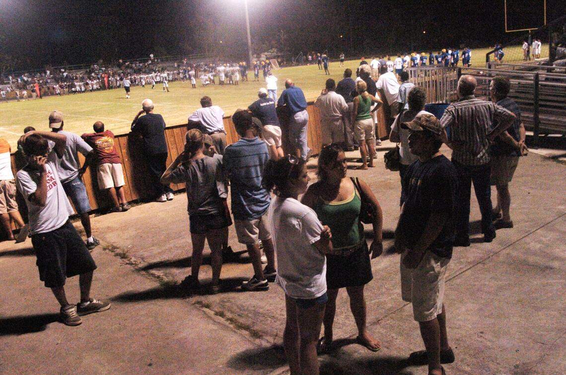 People attended high school football games, like this one at Bay High’s McCullough Stadium in September 2005 for a chance to visit with others and get away from their damaged homes.