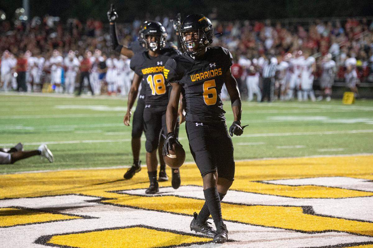 D’Iberville’s Andre Crosby scores a touchdown against Biloxi at Warriors Stadium in D’Iberville on Friday, Sept. 23, 2022.
