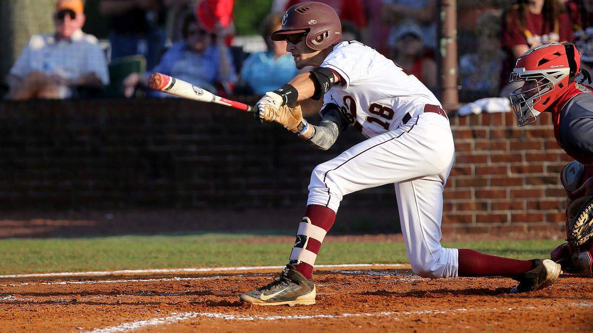 AMANDA McCOY/SUN HERALD 
 George County first baseman Conner Dunlap hits a single to bring in the first run of the game against Petal in the opening game of the Class 6A South State series on Thursday, May 12, 2016.