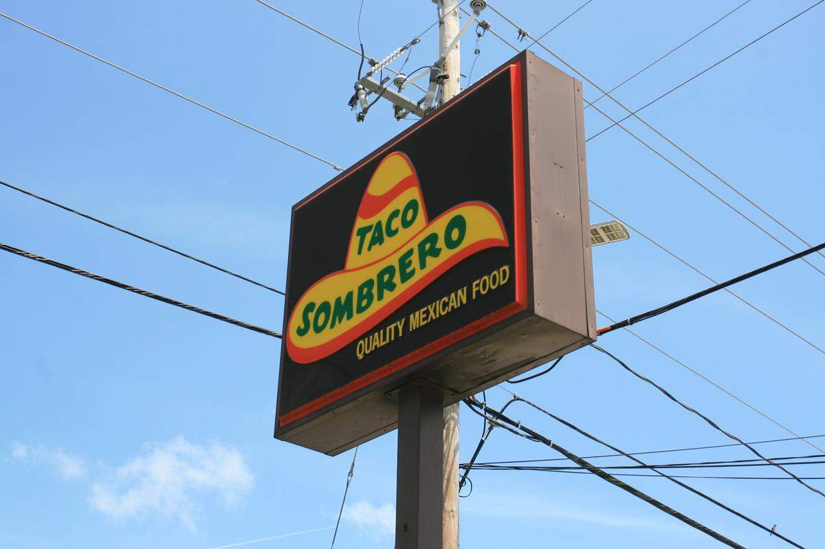 The sign of Taco Sombrero’s Gulfport location, on Highway 49, stands tall on a sunny day.