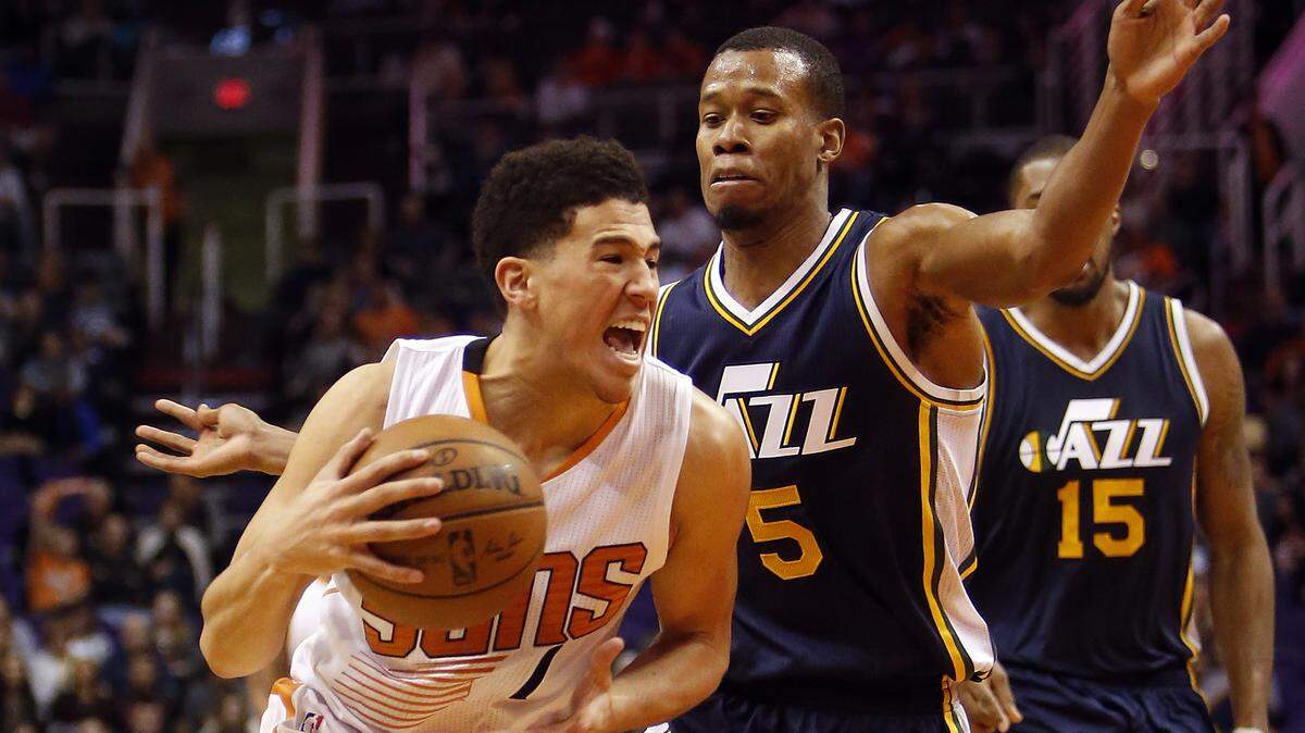 Phoenix Suns guard Devin Booker (1) in the third quarter during an NBA basketball game against the Utah Jazz, Saturday, Feb. 6, 2016, in Phoenix. The Jazz defeated the Suns 98-89. (AP Photo/Rick Scuteri)