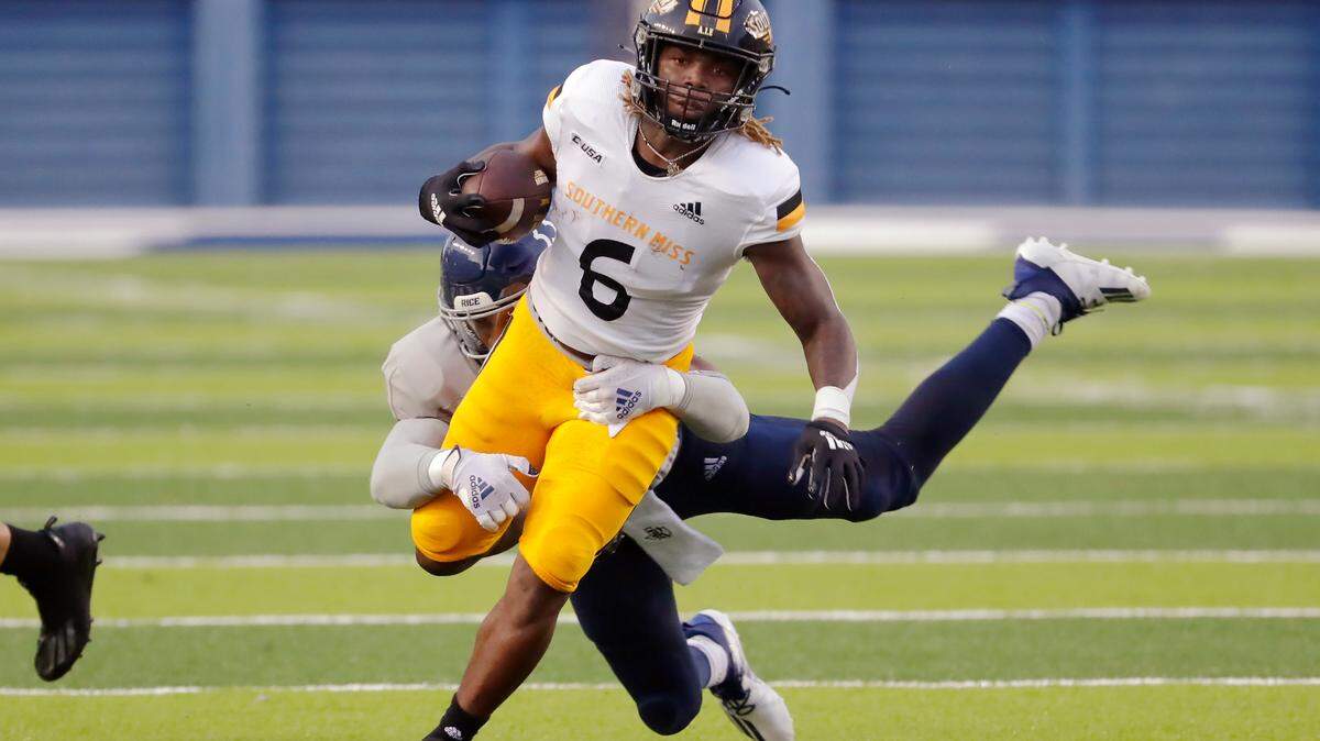 Southern Mississippi running back Dajon Richard (6) breaks the tackle attempt by Rice linebacker Myron Morrison, left, during the first half of an NCAA college football game Saturday, Oct. 2, 2021, in Houston, Texas. (AP Photo/Michael Wyke)