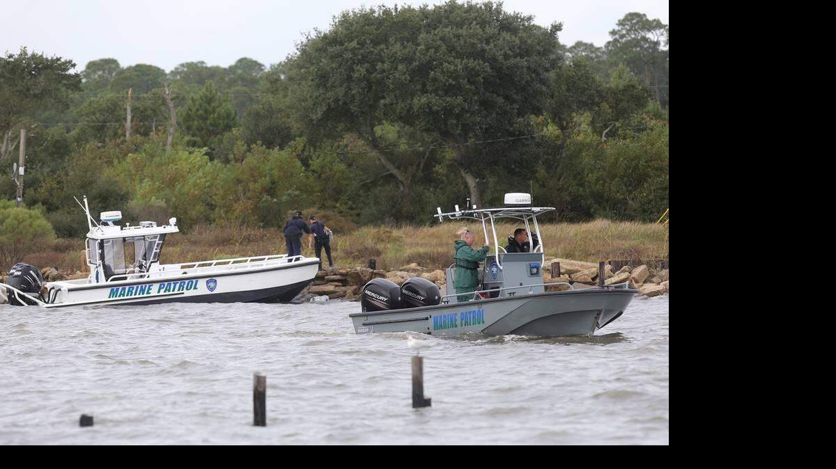 In a photo taken Oct. 27, 2015, Department of Marine Resources personnel search for a plane missing in the waters south of Belle Fontaine Beach in Jackson County.