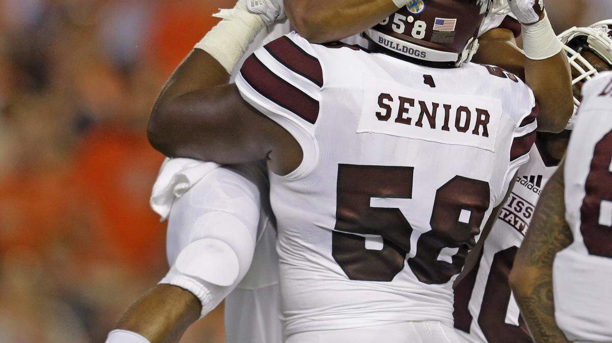 Mississippi State wide receiver Gabe Myles (35) celebrates with offensive lineman Justin Senior (58) after scoring a touchdown during the first half of an NCAA college football game against Auburn, Saturday, Sept. 26, 2015, in Auburn, Ala. (AP Photo/Butch Dill)