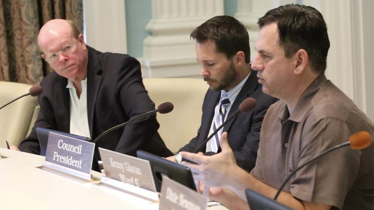 Biloxi Council member Kenny Glavan, right, speaks at a special council meeting in July 2018 about short-term rentals in the city.