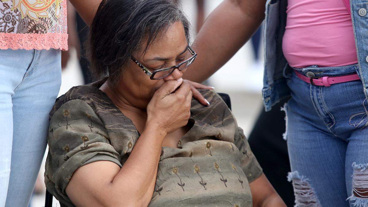 AMANDA McCOY/SUN HERALDStanton Saunders' mother, Vanessa Smith, cries while attending a vigil for her son on Sunday, June 12, 2016. Saunders was shot and killed earlier this week in Gulfport.