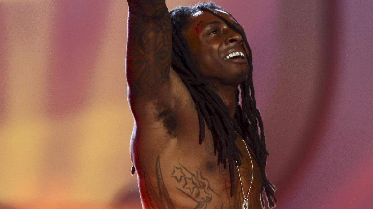 In this Tuesday June 24, 2008 file photo, Lil Wayne performs at the BET Awards in Los Angeles. (AP Photo/Hector Mata)