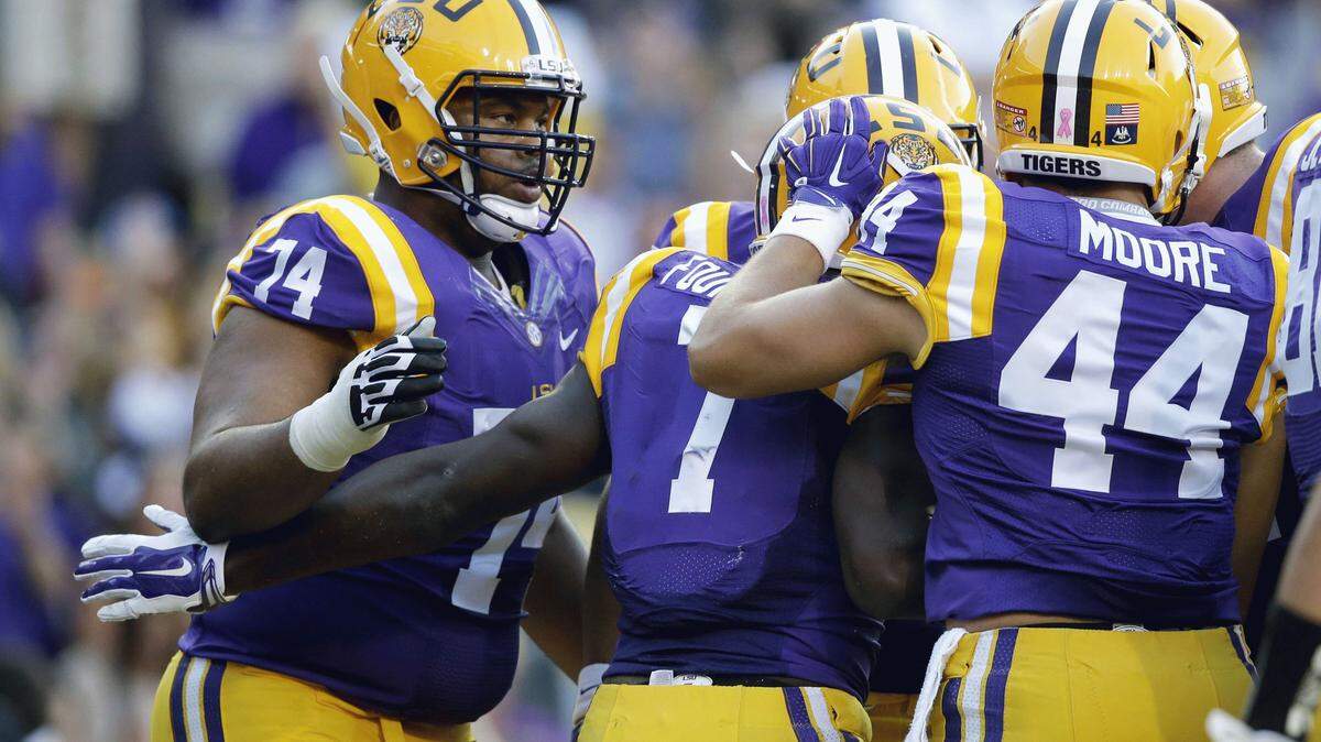 LSU running back Leonard Fournette (7) is congratulated on his touchdown carry in the first half of an NCAA college football game against Eastern Michigan in Baton Rouge, La., Saturday, Oct. 3, 2015. (AP Photo/Gerald Herbert)
