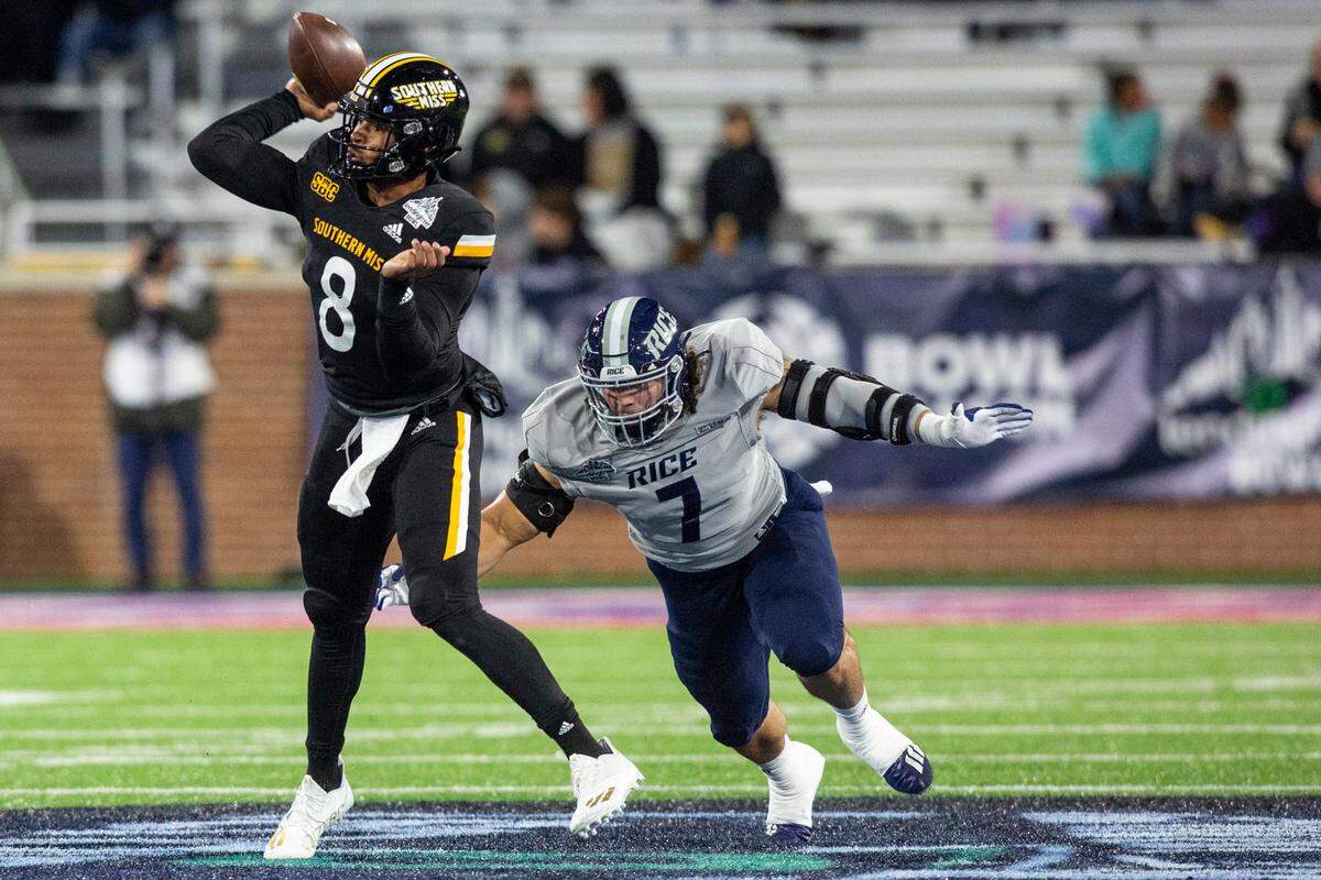 Southern Miss’ quarterback Trey Lowe gets tackled by Rice’s Trey Schuman during the Lending Tree Bowl at Hancock Whitney Stadium in Mobile, Alabama on Saturday, Dec. 17, 2022.