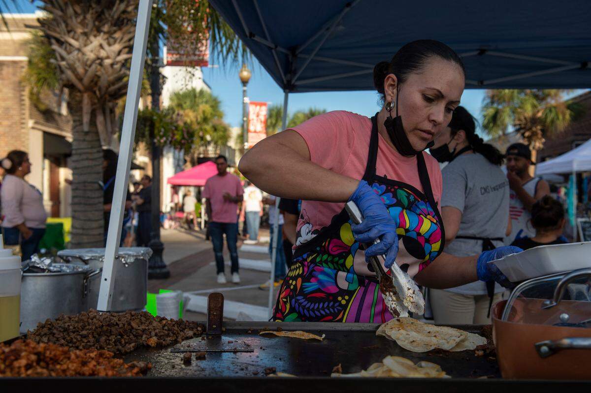 Alma Figueroa cooks tacos for customers during the Festival Hispano de Pascagoula in Pascagoula on Friday, Sept. 24, 2021.