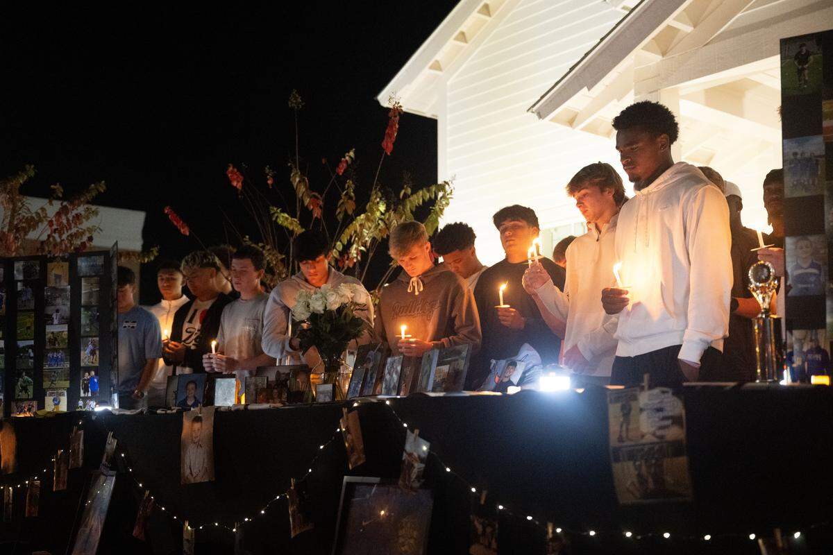 Landon Perry’s soccer teammates gather honor their fallen teammate Thursday.