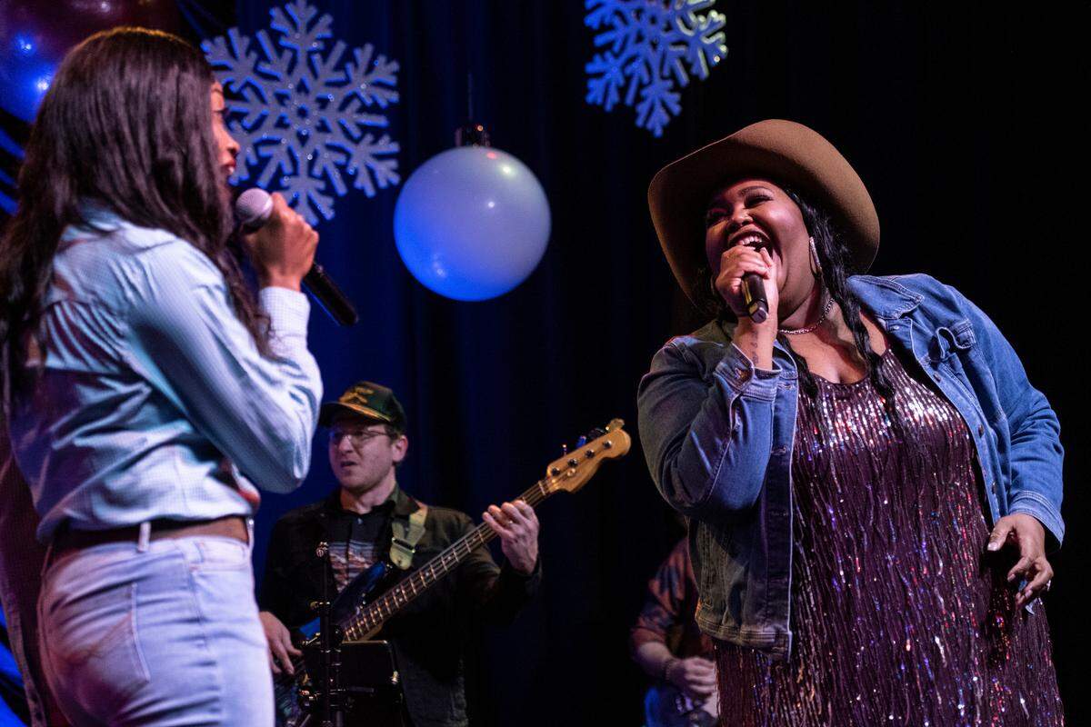 Chapel Hart sisters Danica and Devynn Hart sing next to each other during their show at Ground Zero Blues Club in Biloxi on Wednesday, Nov. 30, 2022.