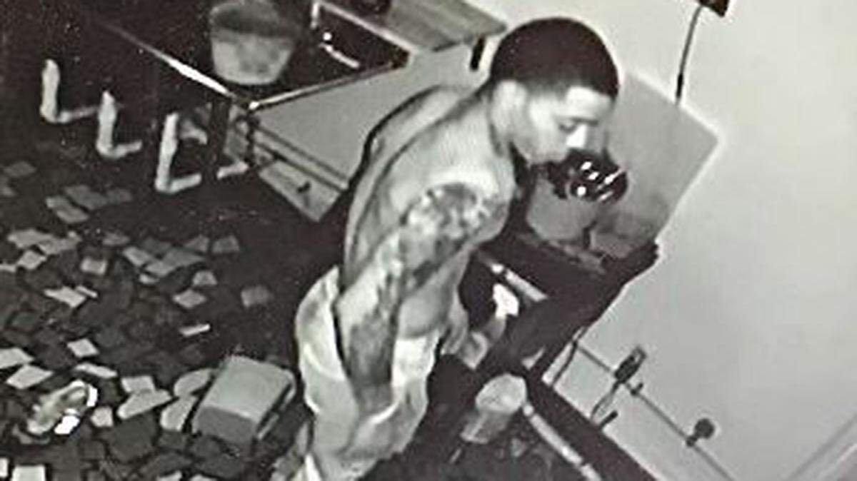 This man, shown inside The Hideway Restaurant in Ocean Springs on Sunday is sought by police on a burglary charge.