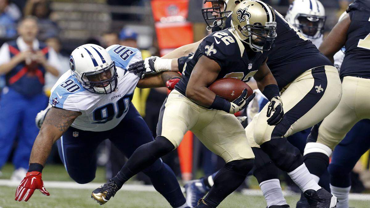 New Orleans Saints running back Mark Ingram (22) carries as Tennessee Titans defensive end DaQuan Jones (90) pursues in the first half of an NFL football game in New Orleans, Sunday, Nov. 8, 2015. (AP Photo/Jonathan Bachman)