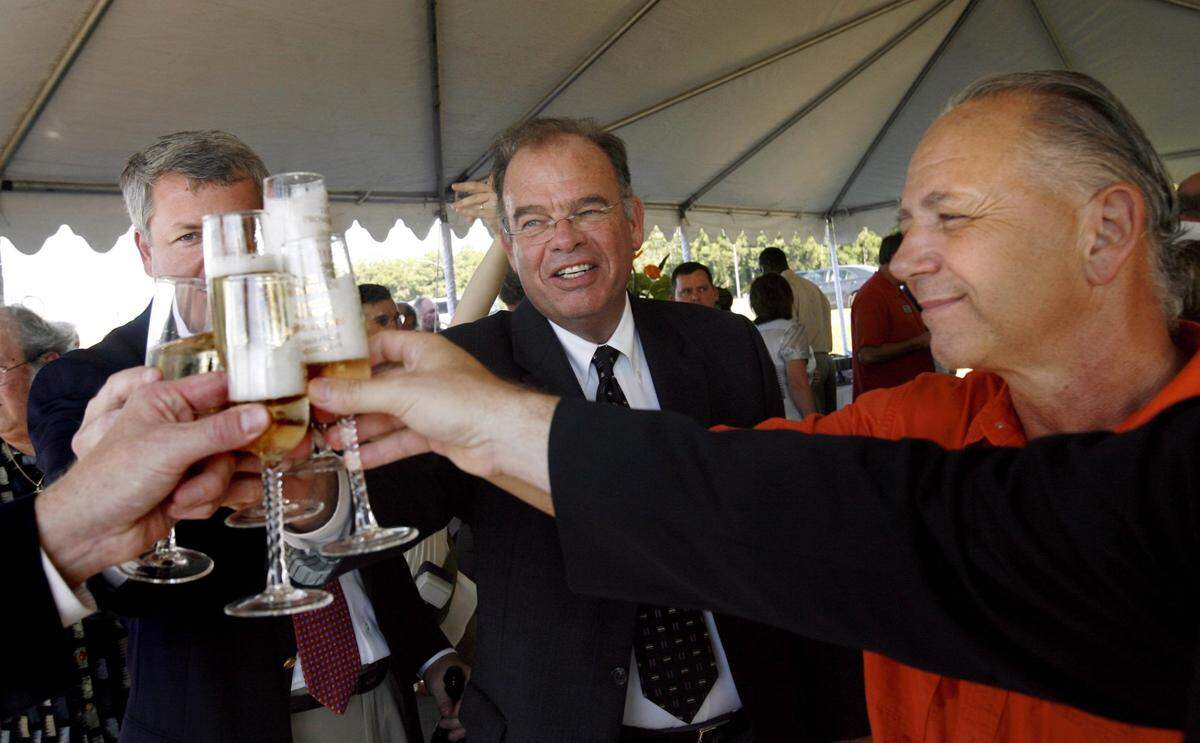 D’Iberville Mayor Rusty Quave, right, smiles as he toasts to the groundbreaking of The Promenade in D’Iberville on July 15 2008. He is joined by Geoff Smith, vice president for CBL & Associates Properties, left, and Steve Tingle, senior vice president-development for CBL, center. Now 17 years later, the shopping center has been sold.