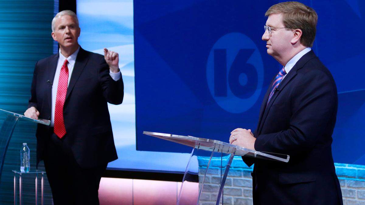 Brandon Presley, the Democratic nominee for governor, left, debates with Republican Mississippi Gov. Tate Reeves during a televised gubernatorial debate Wednesday, Nov. 1, 2023, in Jackson, Miss. (Brett Kenyon/WAPT via the AP)