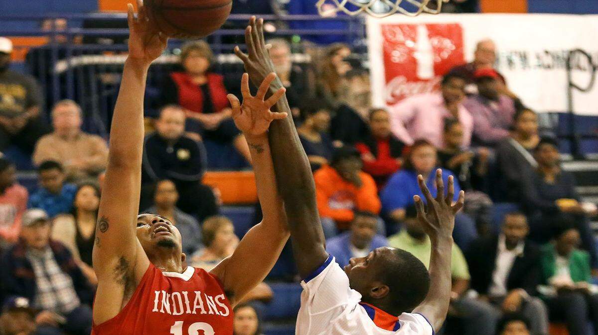 AMANDA McCOY/SUN HERALD 
 Biloxi's Fred Ramsey-Thompson attempts a basket while guarded by Gulfport's Dequarius McCOrd on Friday, Feb. 12, 2016, at Gulfport High.