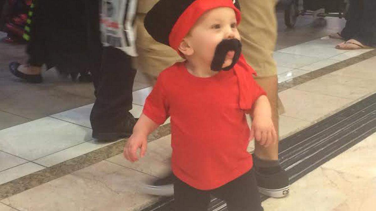 JAMES SKRMETTA/SUN HERALDJames Leenen, 1, frolics through the halls of Edgewater Mall searching for candy at the annual 'Trick or Treat at the Edge' event Saturday.