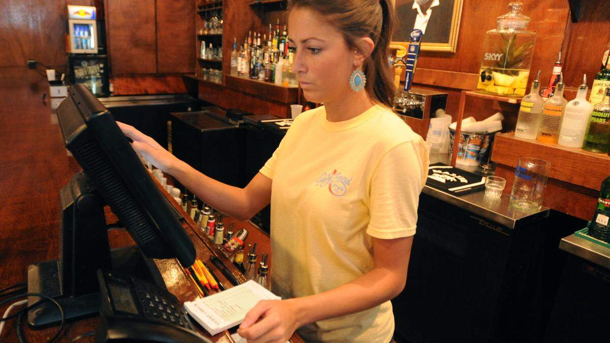 RYAN MOORE/HATTIESBURG AMERICAN 
 Jessica Boehmer enters items on the computer at the bar in the Glory Bound Gyro Company.