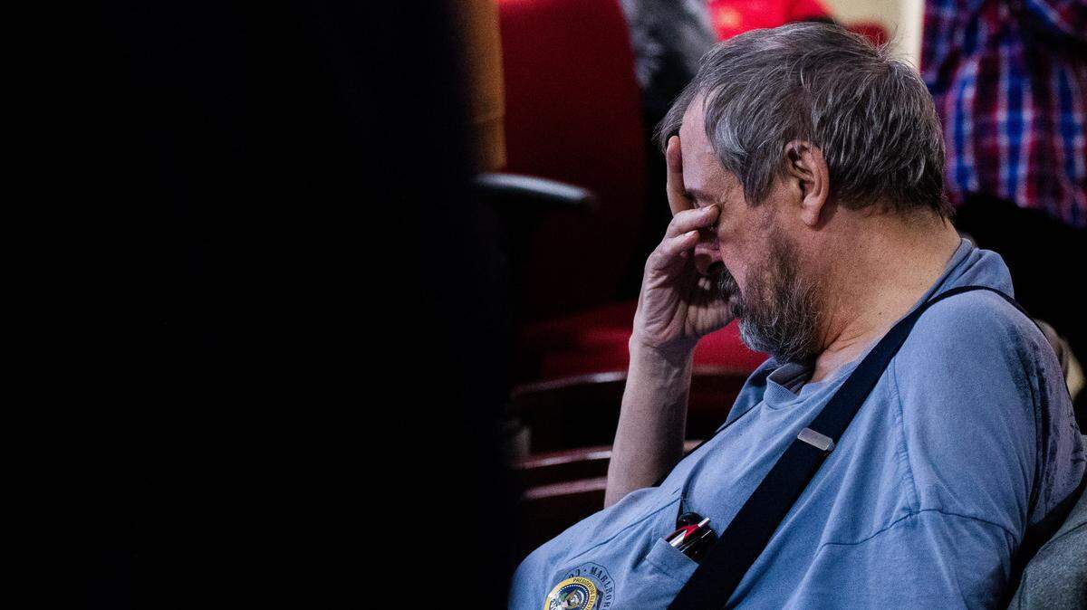 An attendee of the Harrison County (Miss.) Republicans’ election watch party bows his head following the calling of a state for Joe Biden on Tuesday, Nov. 3, 2020.