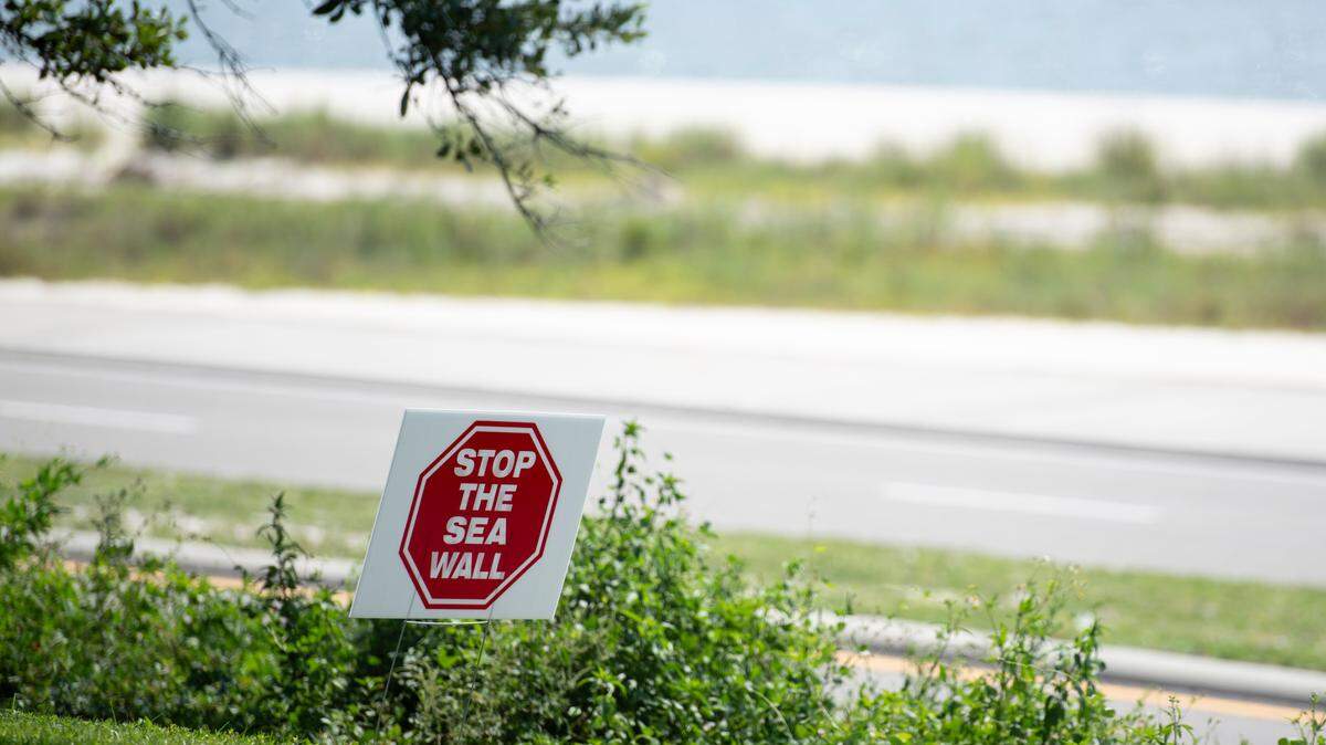 A Stop The Sea Wall sign on Scenic Drive in Pass Christian on Wednesday, Aug. 21, 2024. Some residents banded together in opposition of a boardwalk being build along Highway 90 because they said that city leaders had not shared enough information with the public, the project would ruin their view of the beach and limit beach access.