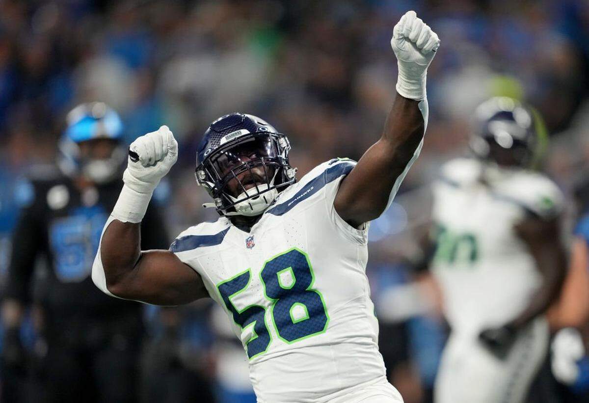 DETROIT, MICHIGAN - SEPTEMBER 30: Derick Hall #58 of the Seattle Seahawks celebrates a play against the Detroit Lions during the second quarter at Ford Field on September 30, 2024 in Detroit, Michigan. (Photo by Nic Antaya/Getty Images)