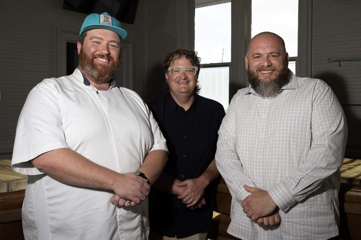 Chef Austin Sumrall, left, owner Joe Cloyd, middle, and general manager Ridge Chambers, right, prepare for the opening of the new Chandeleur Depot Brewpub in Pascagoula.