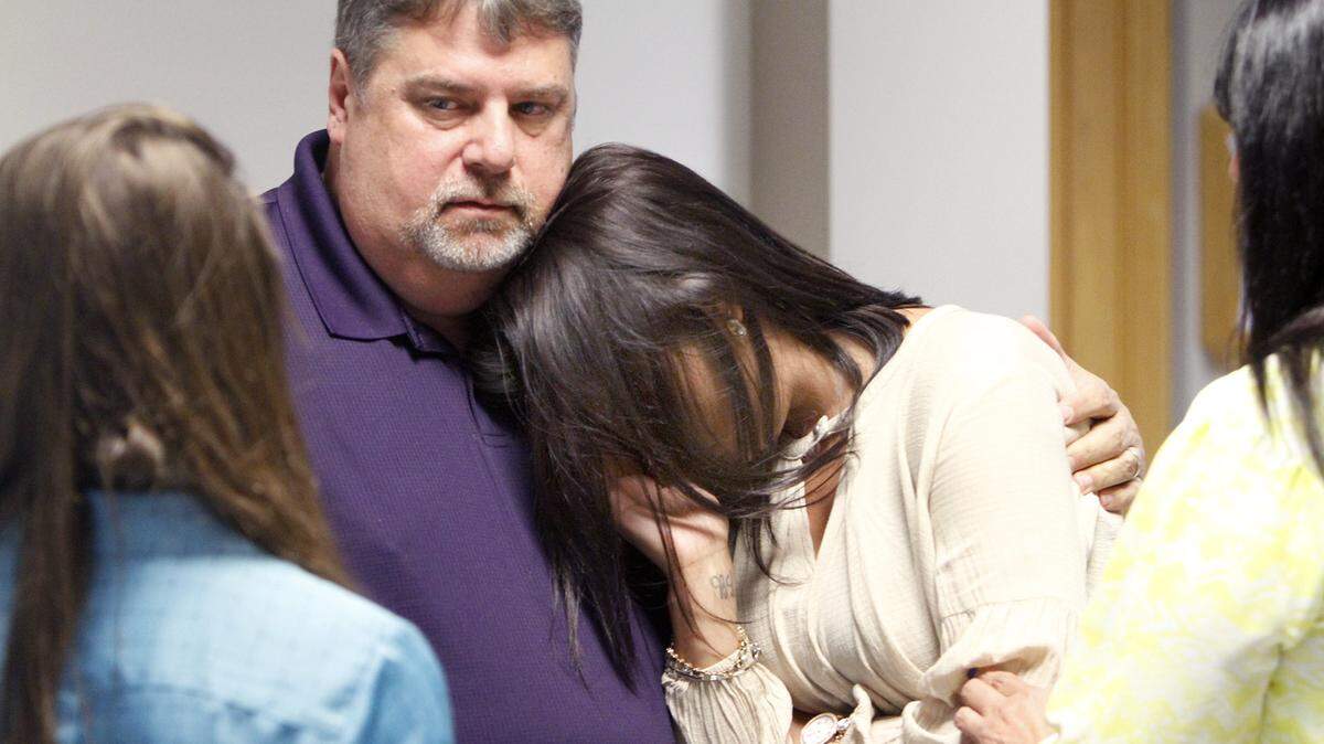 TIM ISBELL/SUN HERALD 
 Emily Saucier leans of Jimmy Spears upon leaving the courtroom after Nathan McCrory's preliminary hearing, Monday, May 9, 2016.